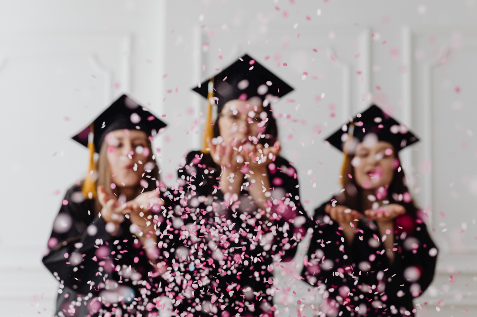 Three girls celebrating their graduation